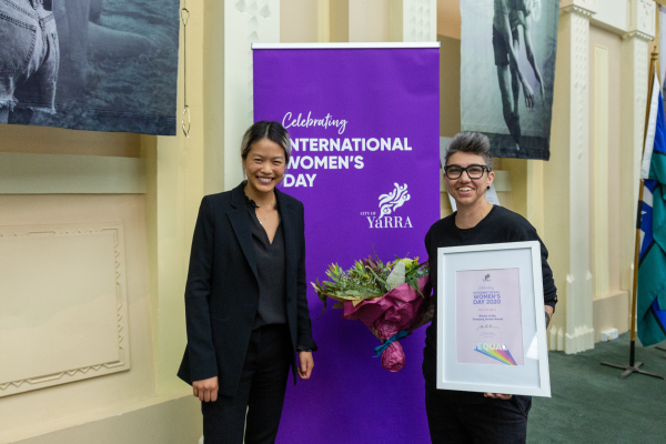 Cr Mi-Lin Chen Yi Mei with Rani Anders holding a certificate and bunch of flowers