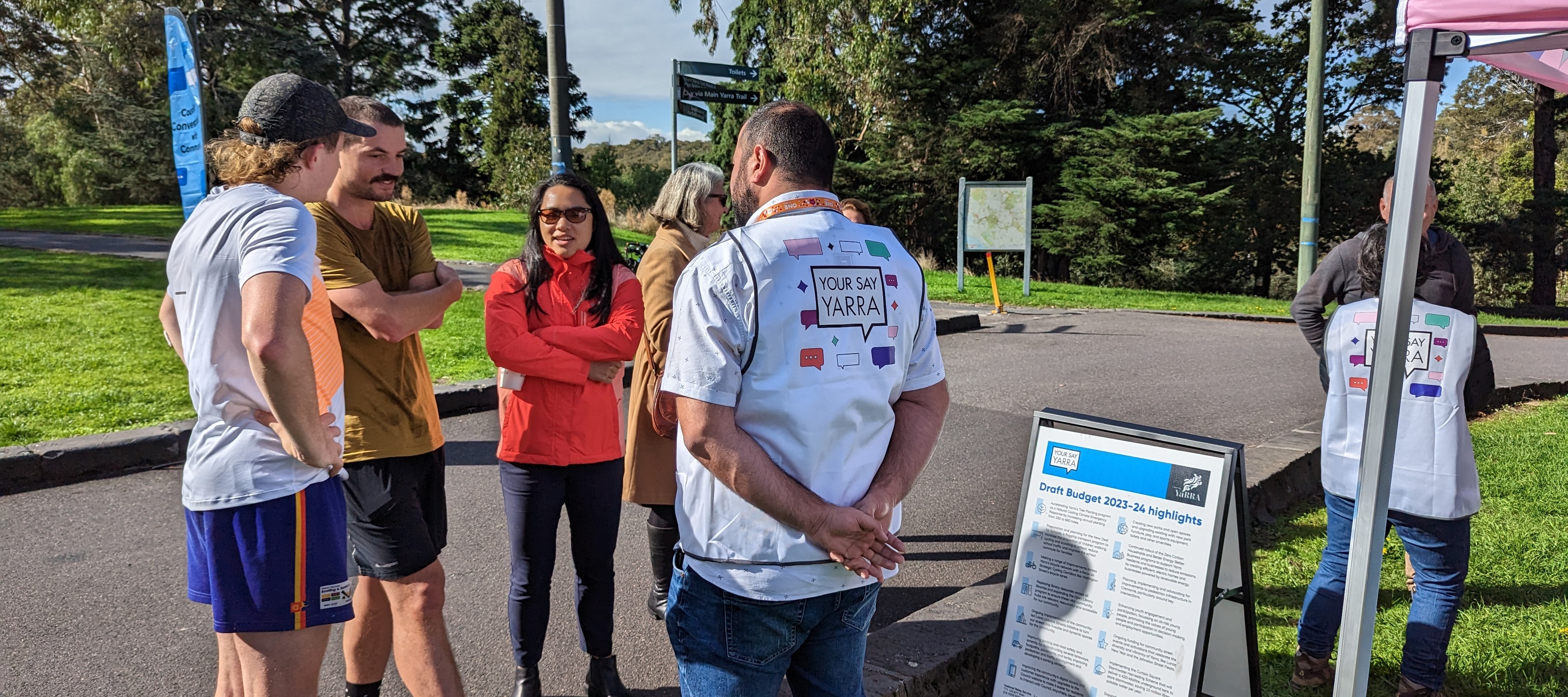 Yarra Councillor Claudia Nguyen talks with members of the community at a local park