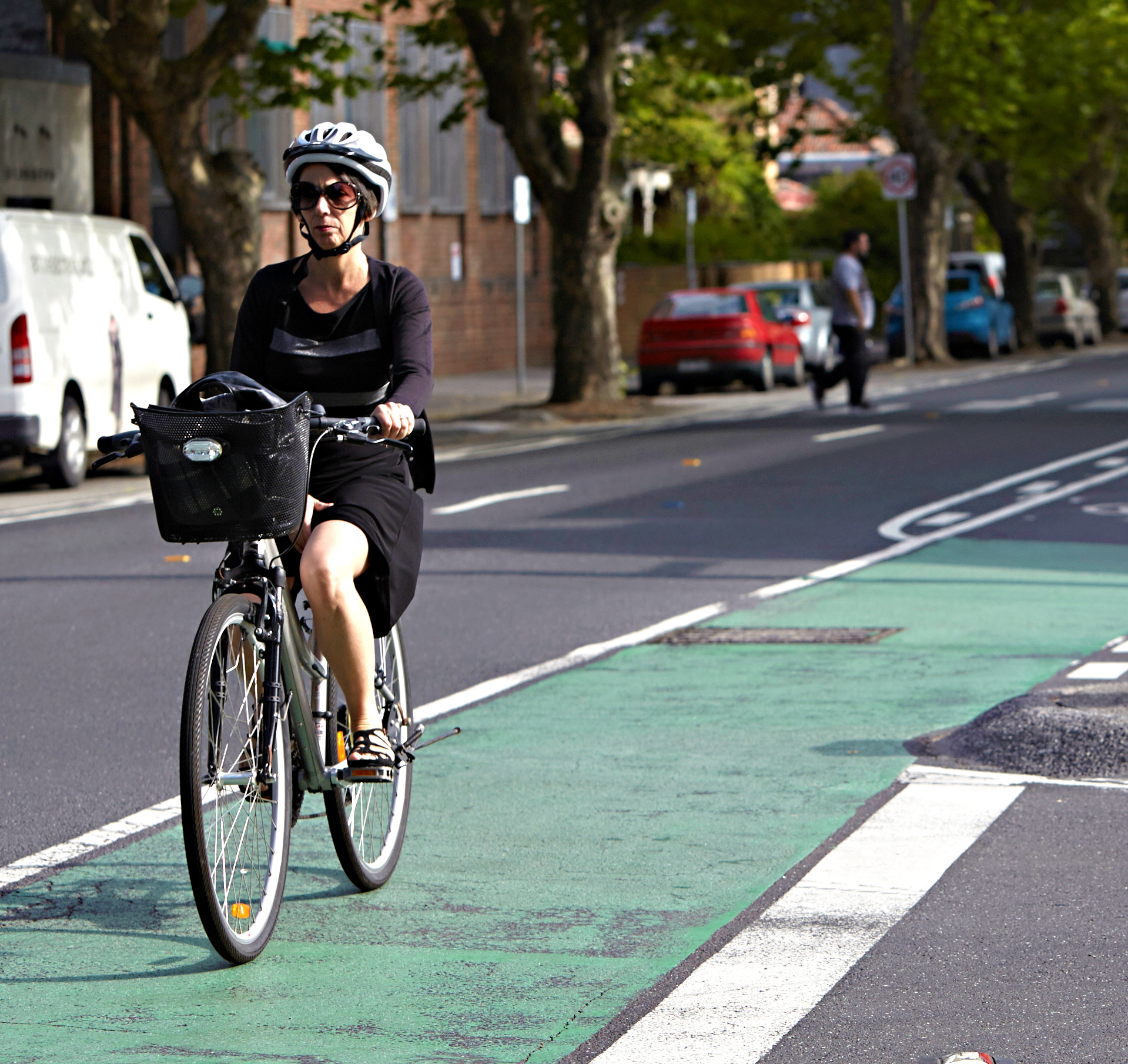 Woman cycling in bike lane