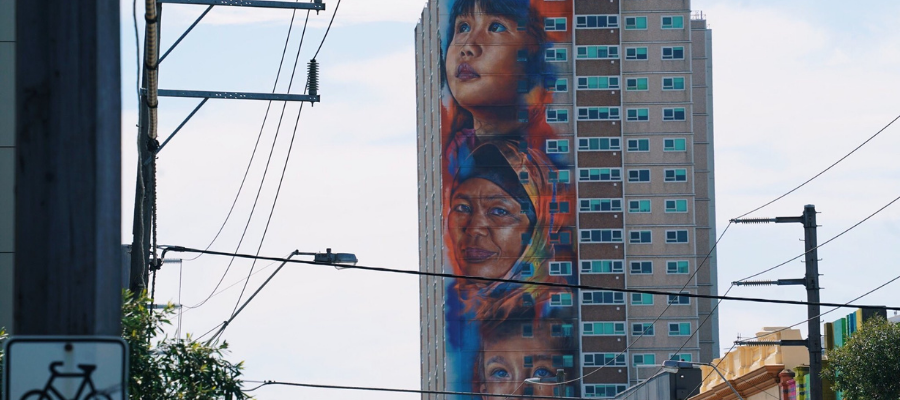 High rise social housing, with the artist Matt Adnate's mural of multi-cultural faces in Yarra