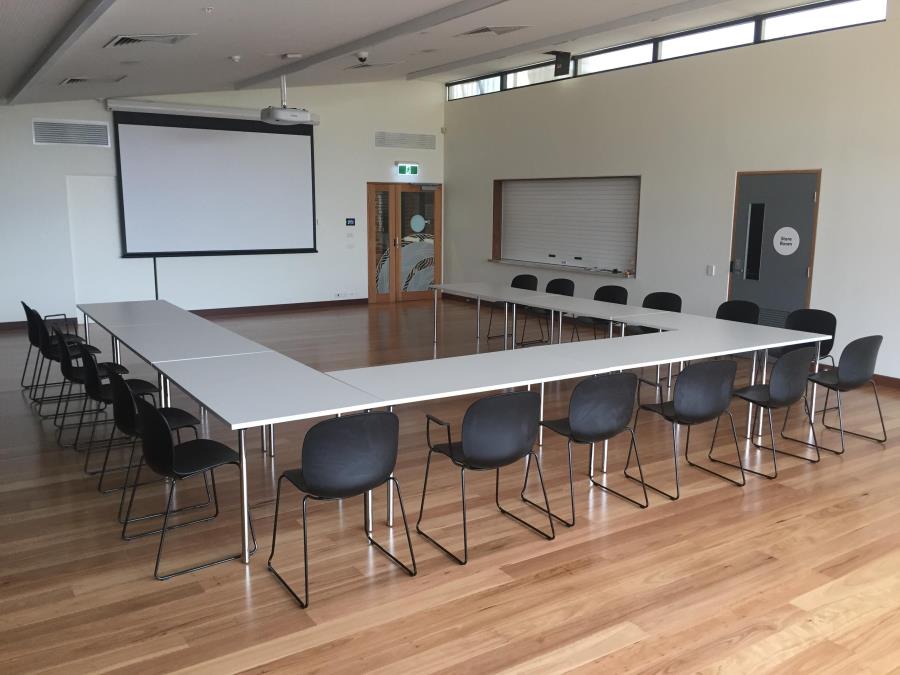 Photo of Community Room with tables setup in U-shape
