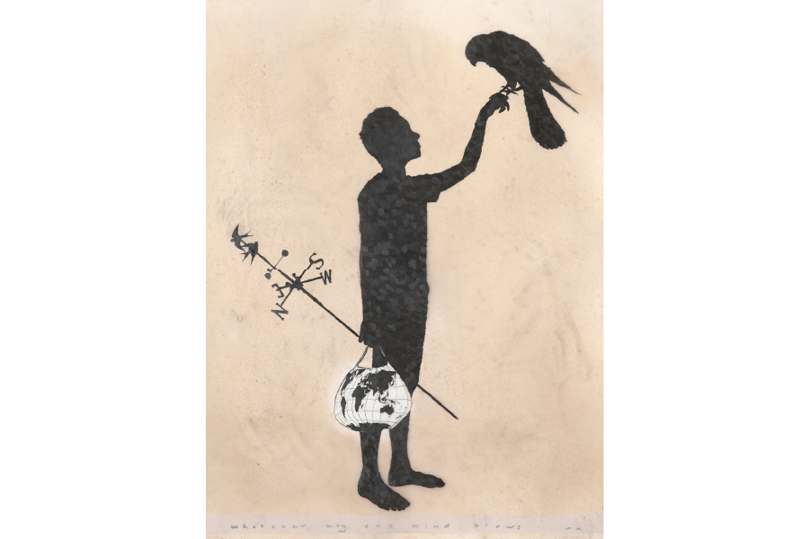 A person holding a bird in one hand and in the other is holding a bag with the world globe on it