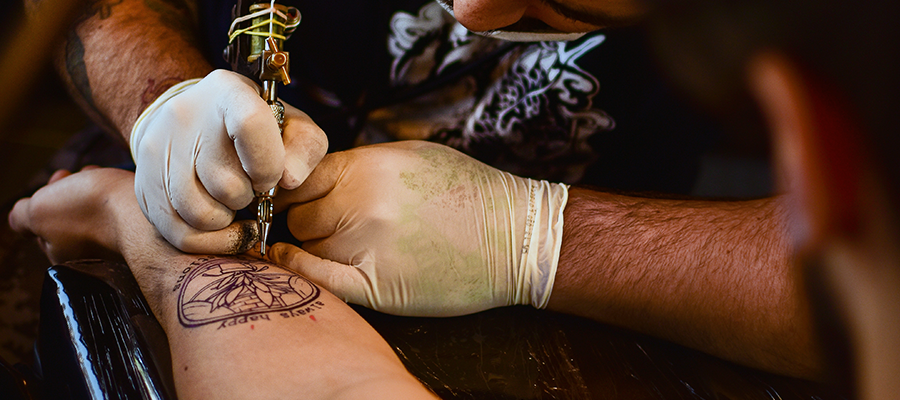 Tattoo being applied to person's forearm
