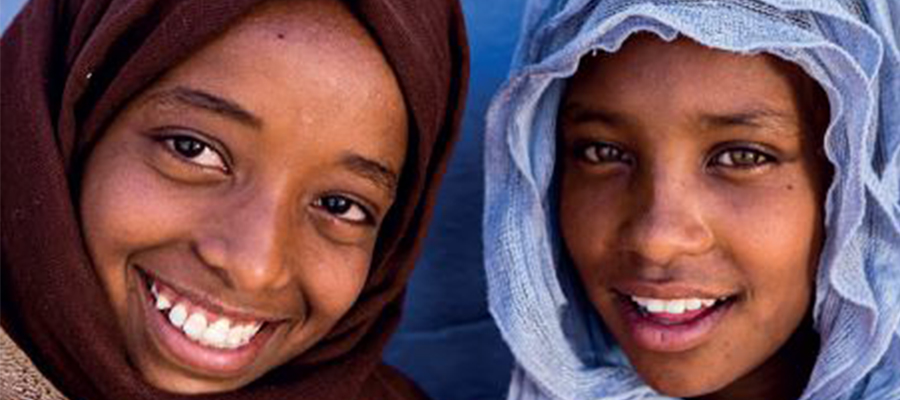 Two young girls wearing a headscarf