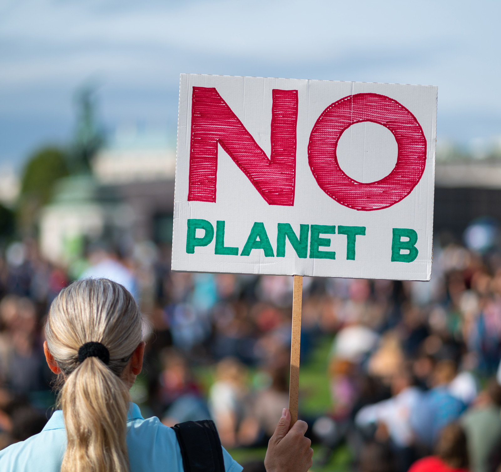 Person holding sign that says 'No Planet B' at a protest
