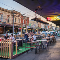 People dining out on street in temporary parklet