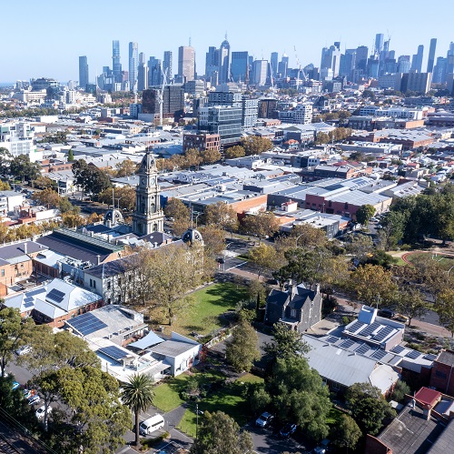 Drone image of Collingwood with city in background.
