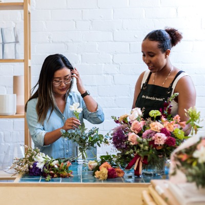 Three florists arranging bouquets together