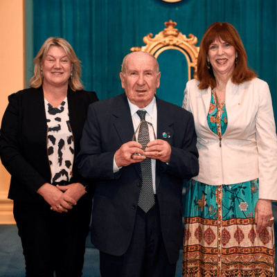Yarra resident Antonio 'Tonino' Bentincontri, center, receives the Senior Achiever Award at the 2023 Victorian Senior of the Year Awards, held at Government House.