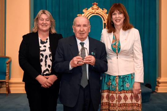 Yarra resident Antonio 'Tonino' Bentincontri, center, receives the Senior Achiever Award at the 2023 Victorian Senior of the Year Awards, held at Government House.