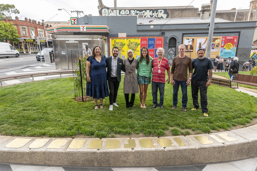 Group of people stand in Otter Street pocket park