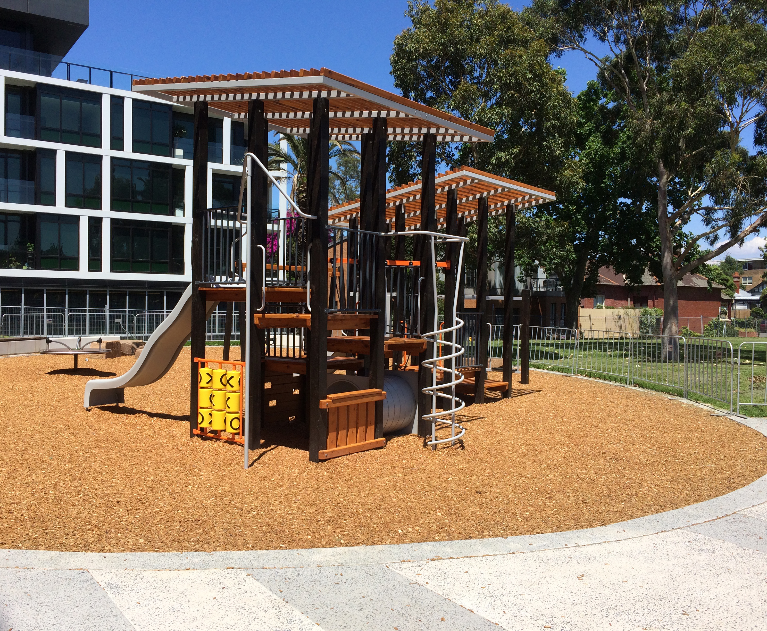 A new playground with apartments in the background