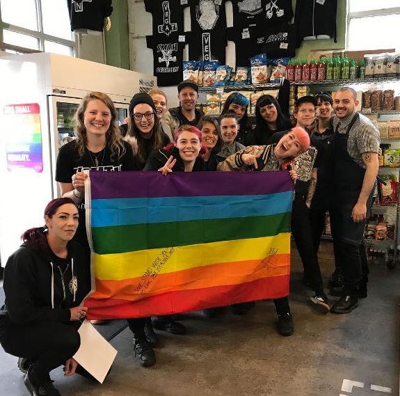 LGBTIQ friendly business with signed flag