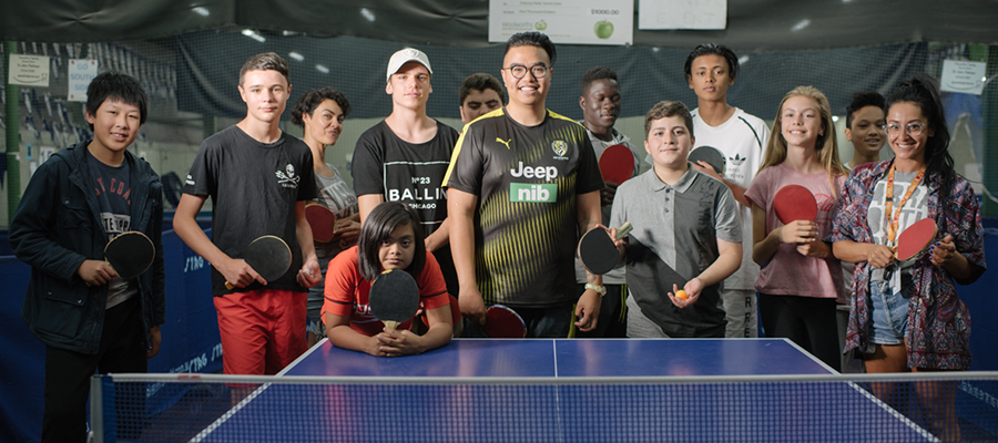 Yarra Mayor, Cr Daniel Nguyen, with school holiday program participants at table tennis table
