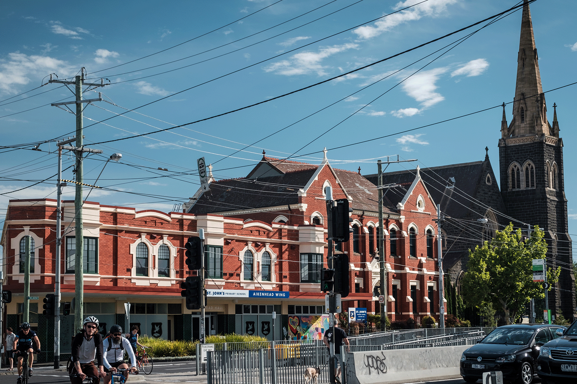 A red brick church on a busy street