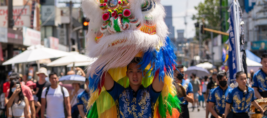 Man holding Chinese dragon head during Lunar festival 