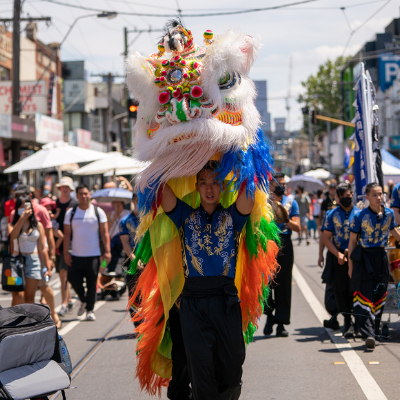 Man holding Chinese dragon head during Lunar festival 