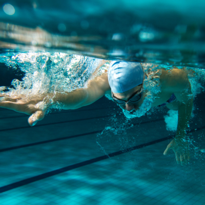 Man swimming freestyle underwater